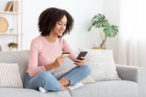 Woman paying on her phone | Student Digs